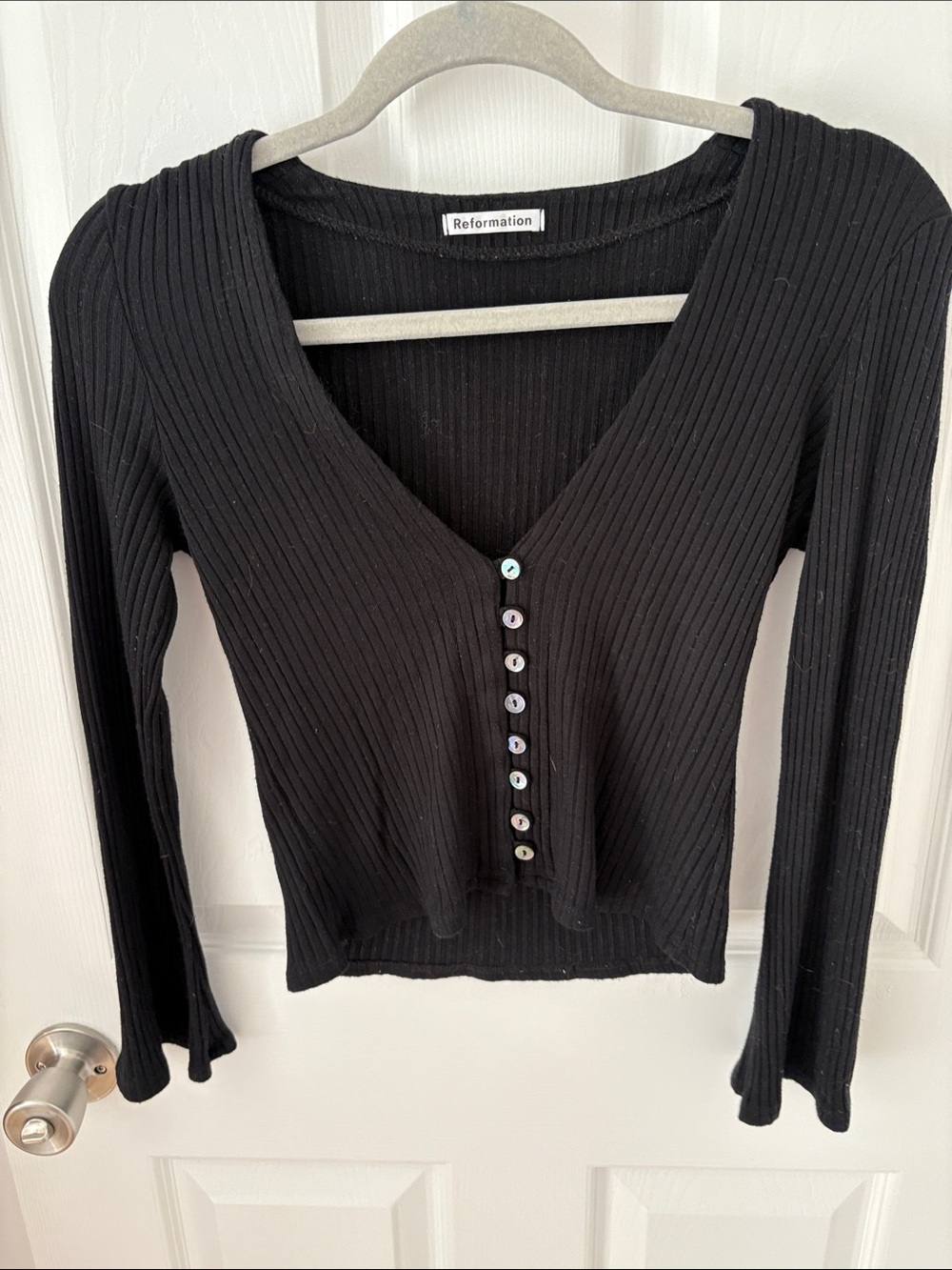 Reformation - Gellar Top. Black Ribbed V-Neck Button-Front Long Sleeve Top